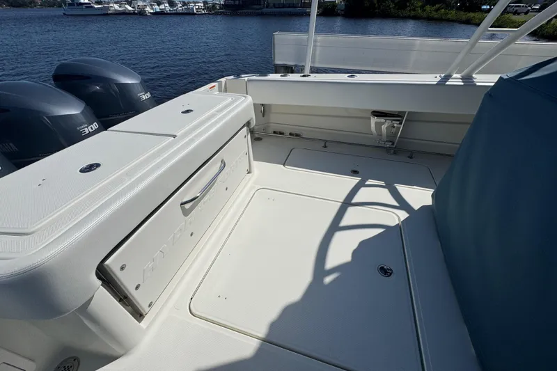 Slide: The Image of 2012 Hydra-Sports 4200 Siesta boat deck with Yamaha 300 engines, docked by the water. - 34