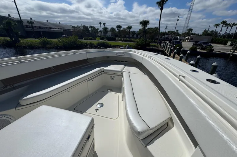 Slide: The Image of 2012 Hydra-Sports 4200 Siesta boat with spacious seating and sleek design at a dock. - 37