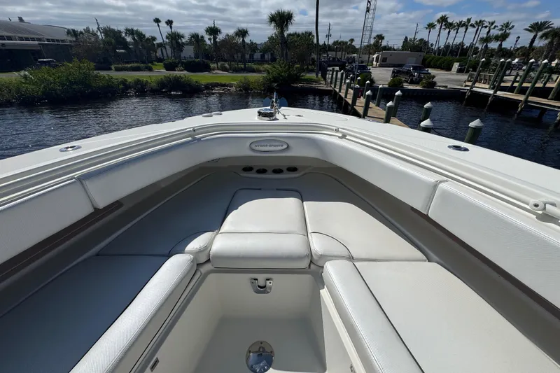 Slide: The Image of 2012 Hydra-Sports 4200 Siesta boat interior with white seating, dockside view. - 38