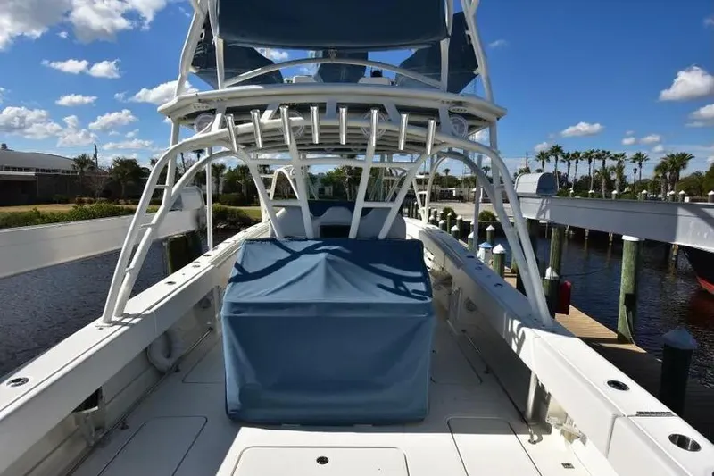 Slide: The Image of 2012 Hydra-Sports 4200 Siesta boat docked under a clear blue sky. - 4