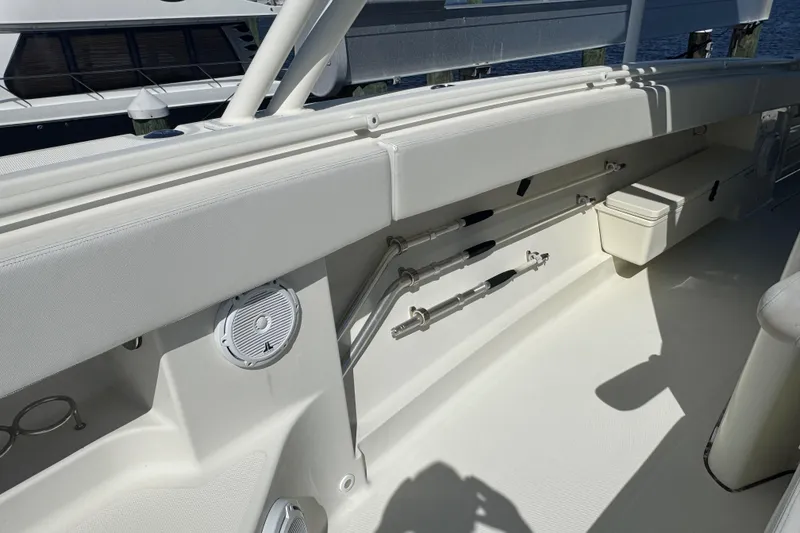 Slide: The Image of 2012 Hydra-Sports 4200 Siesta boat interior with rod holders and seating. - 40