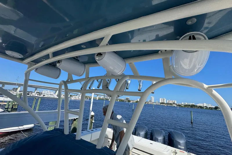 Slide: The Image of 2012 Hydra-Sports 4200 Siesta boat with speakers, ocean view, and city skyline in background. - 45