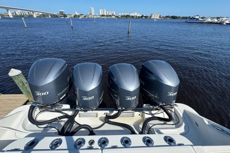 Slide: The Image of 2012 Hydra-Sports 4200 Siesta with four Yamaha 300 engines on a calm waterfront. - 47