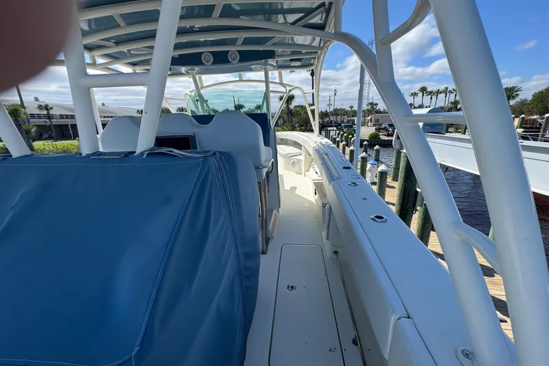 Slide: The Image of 2012 Hydra-Sports 4200 Siesta boat interior with blue seating and white deck. - 49