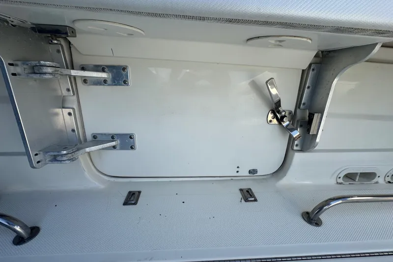 Slide: The Image of 2012 Hydra-Sports 4200 Siesta boat interior with metal hinges and latch. - 50