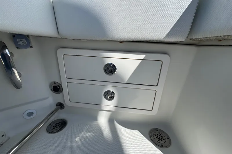 Slide: The Image of 2012 Hydra-Sports 4200 Siesta boat interior with storage compartments and seating. - 52