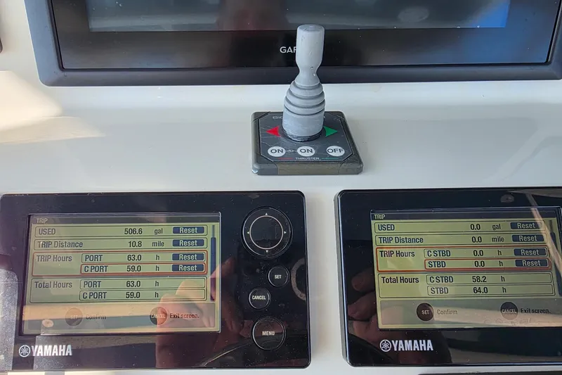 Slide: The Image of Yamaha control panels on a 2012 Hydra-Sports 4200 SF boat dashboard. - 58