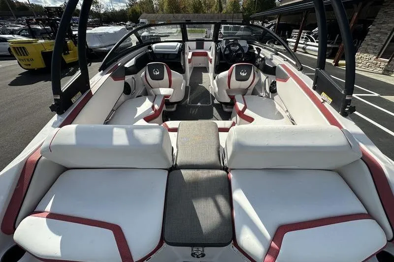 Slide: The Image of Interior of a 2016 Scarab 195 H.O. boat with white and red seating. - 10