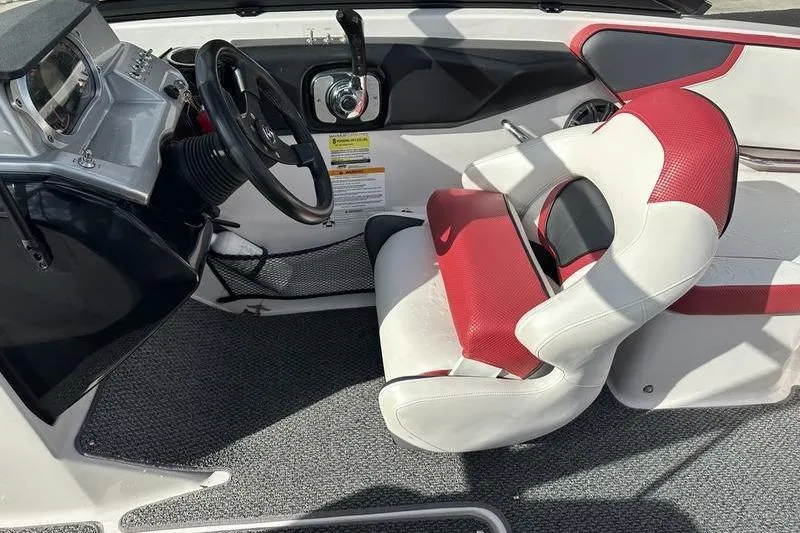 Slide: The Image of Interior of a 2016 Scarab 195 H.O. boat with red and white seating. - 12