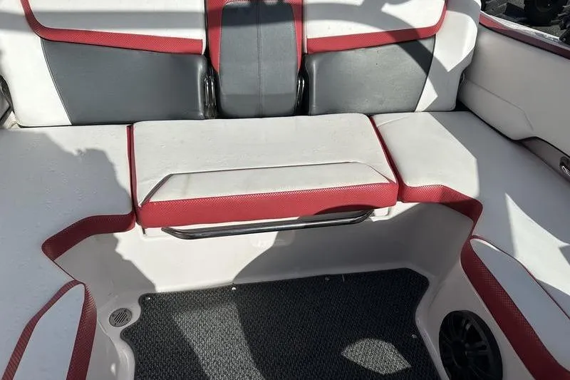 Slide: The Image of Interior seating of 2016 Scarab 195 H.O. boat with red and gray upholstery. - 14