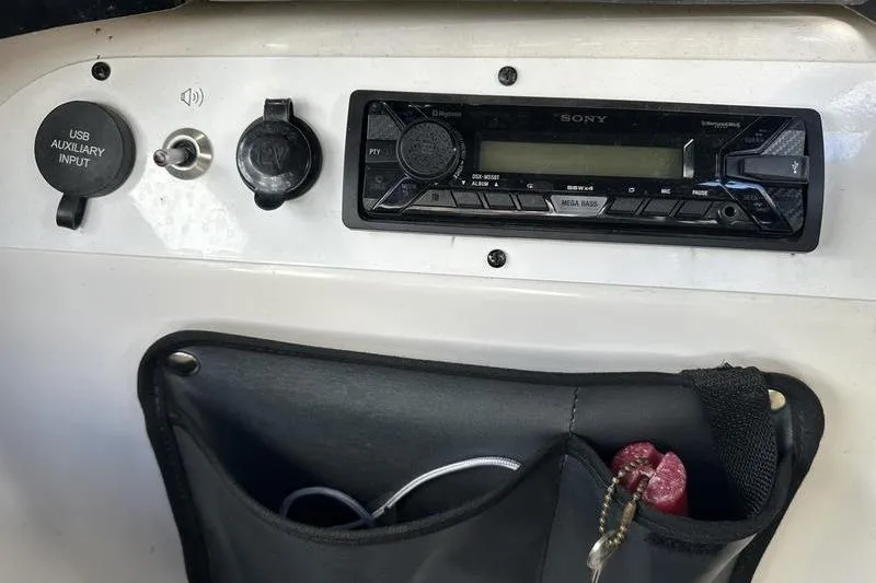 Slide: The Image of Dashboard of a 2016 Scarab 195 H.O. with Sony stereo and USB input. - 16