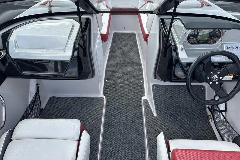 Slide: The Image of 2016 Scarab 195 H.O. boat interior with steering wheel and seating. - 17