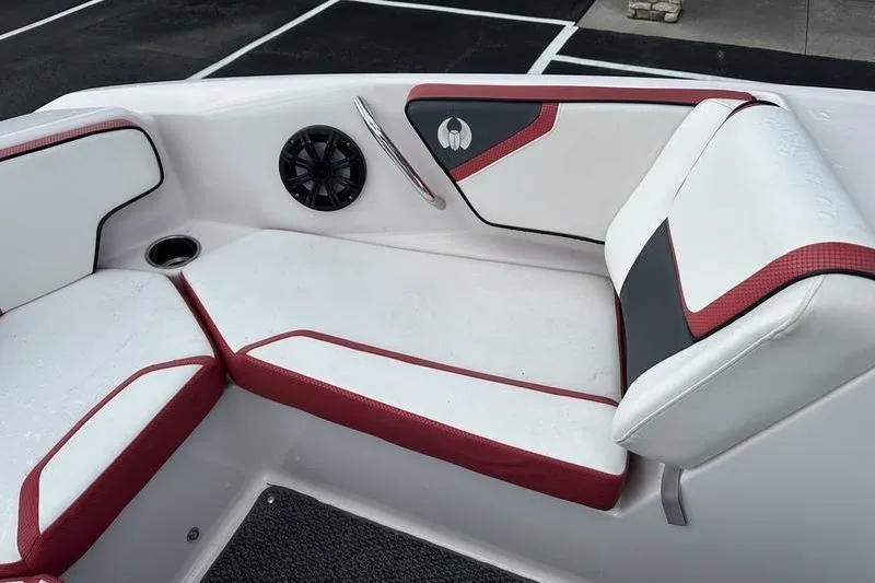 Slide: The Image of Interior seating of a 2016 Scarab 195 H.O. boat with red and white upholstery. - 23