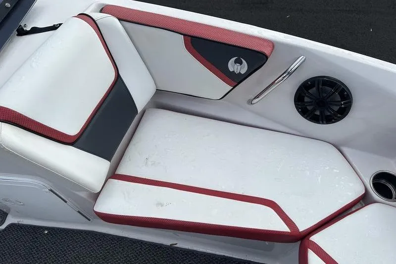 Slide: The Image of 2016 Scarab 195 H.O. boat interior with red and white seating, speaker, and cup holder. - 4