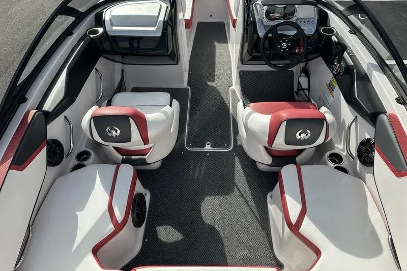 Slide: The Image of 2016 Scarab 195 H.O. boat interior with red and white seating, steering wheel, and dashboard. - 5