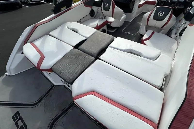 Slide: The Image of 2016 Scarab 195 H.O. boat interior with white and red seating, featuring adjustable cushions. - 8