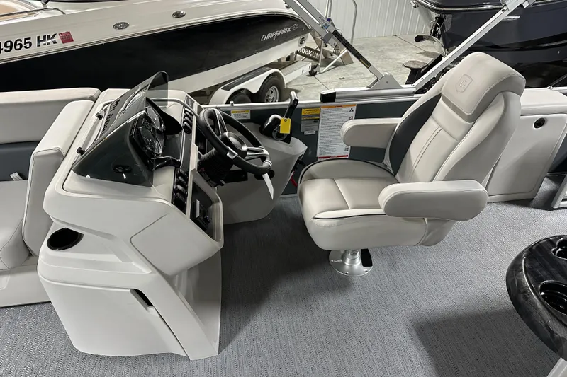 Slide: The Image of Captain's seat and helm of 2026 Godfrey Sweetwater 2286 C pontoon boat. - 16