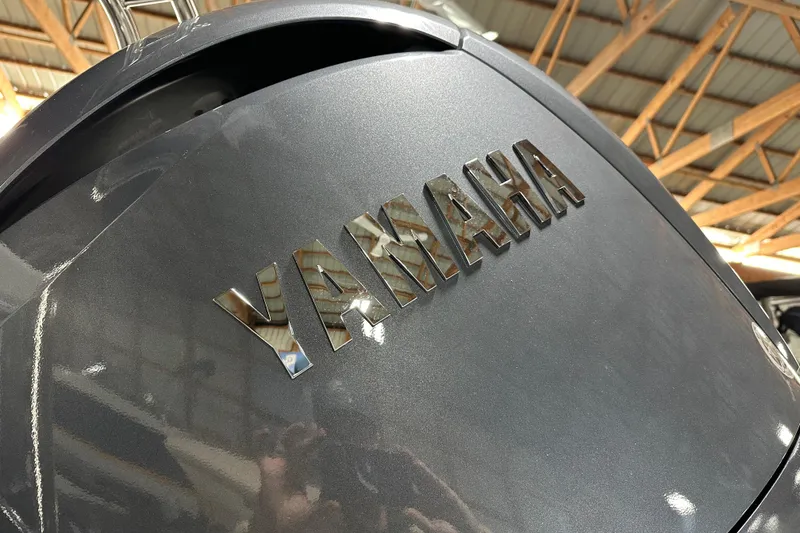 Slide: The Image of Yamaha engine on 2026 Godfrey Sweetwater 2286 C boat, in a wooden-roofed facility. - 4