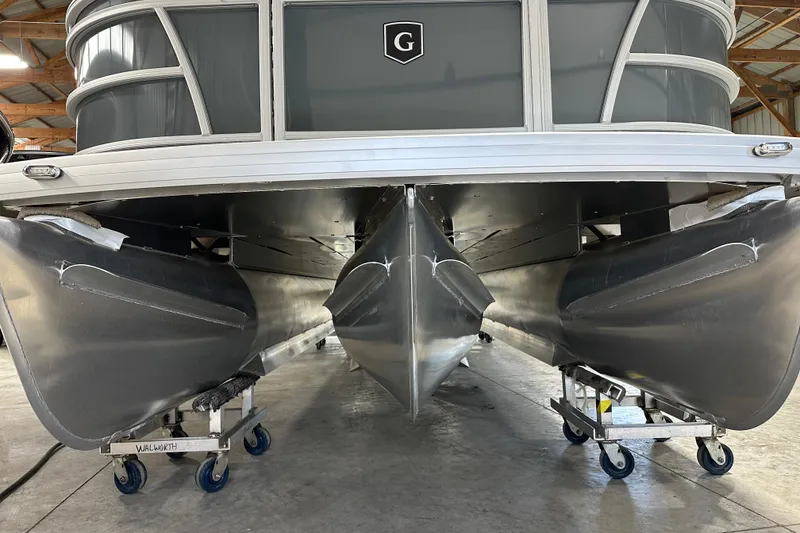 Slide: The Image of 2026 Godfrey Sweetwater 2286 C pontoon boat in a storage facility, viewed from below. - 8