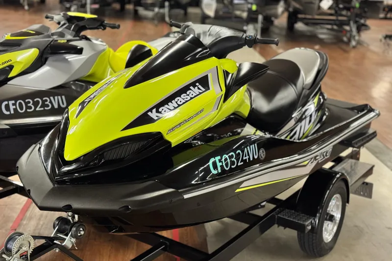 The Image of 2021 Kawasaki Jetski Ultra 310X in vibrant yellow and black on a trailer. - 1