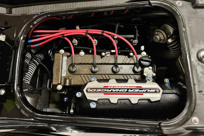 Slide: The Image of 2021 Kawasaki Jetski Ultra 310X engine with supercharger and red ignition wires. - 11