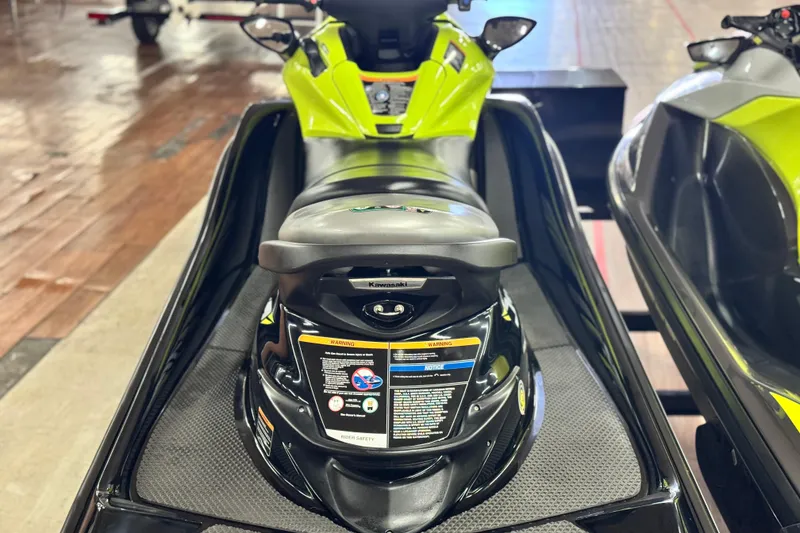 Slide: The Image of 2021 Kawasaki Jetski Ultra 310X, vibrant green, displayed indoors on a wooden floor. - 6