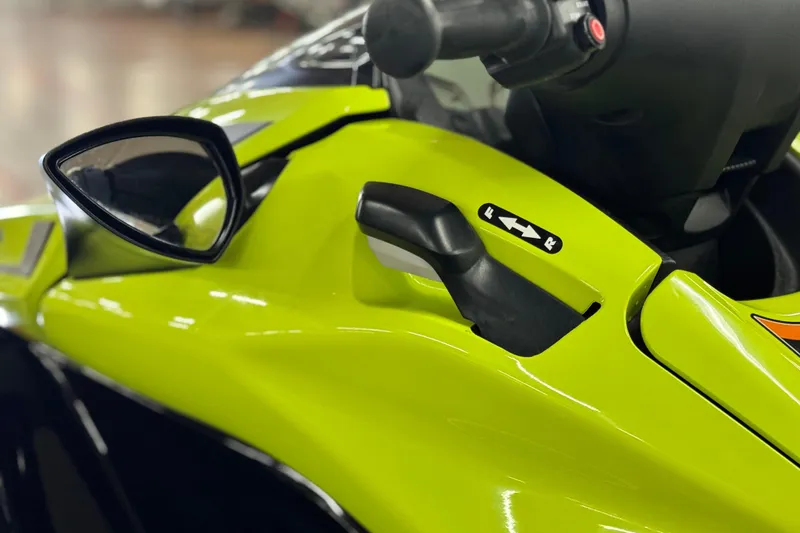 Slide: The Image of Close-up of 2021 Kawasaki Jetski Ultra 310X handle and controls, vibrant green color. - 7