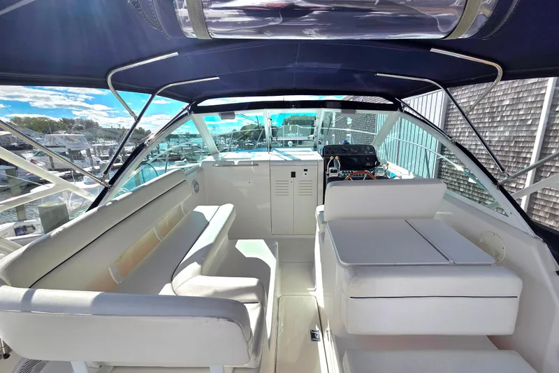 Slide: The Image of 2004 Tiara 29 Coronet Harbor Edition boat interior with seating and helm. - 11