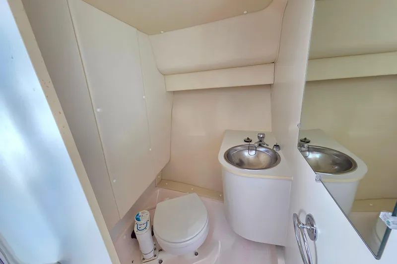 Slide: The Image of 2004 Tiara 29 Coronet Harbor Edition boat bathroom with sink and toilet. - 12