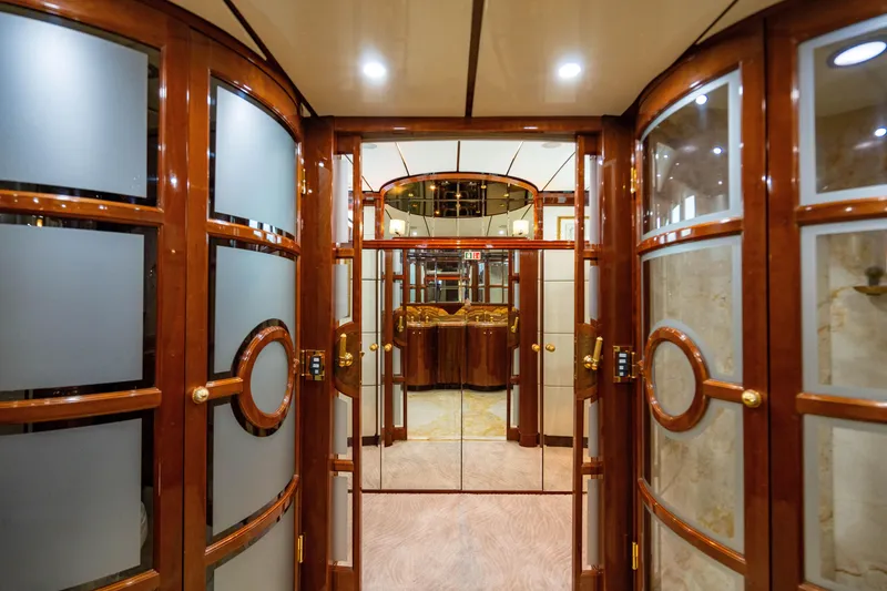Slide: The Image of Luxurious interior of 2000 Destiny Flybridge Motor Yacht with elegant wood and glass design. - 10