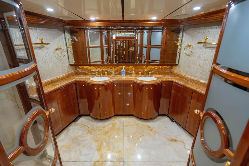Slide: The Image of Luxurious bathroom on 2000 Destiny Flybridge Motor Yacht with elegant wood and marble finishes. - 11