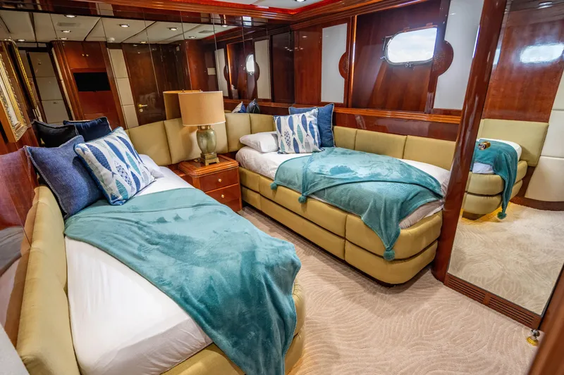Slide: The Image of Luxurious twin cabin interior on 2000 Destiny Flybridge Motor Yacht, featuring elegant decor and plush bedding. - 16