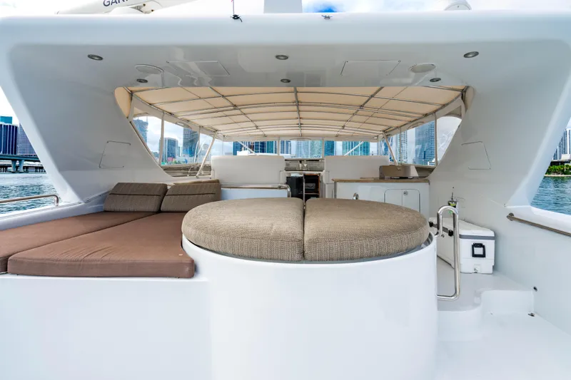 Slide: The Image of Luxurious 2000 Destiny Flybridge Motor Yacht with spacious deck and city skyline view. - 19