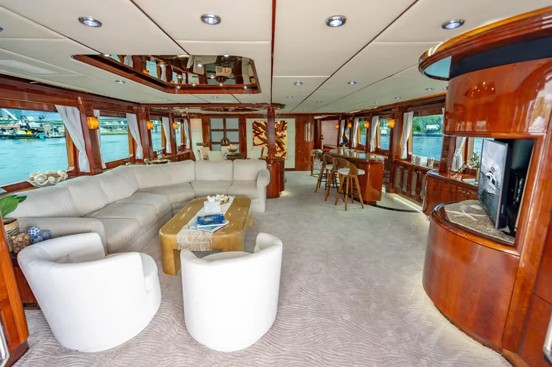 Slide: The Image of Luxurious interior of 2000 Destiny Flybridge Motor Yacht with elegant seating and wood finishes. - 2