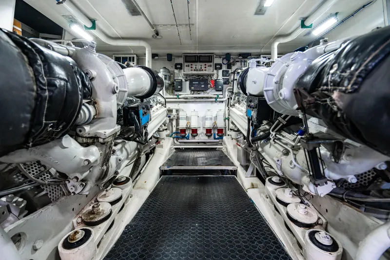 Slide: The Image of Engine room of a 2000 Destiny Flybridge Motor Yacht, showcasing machinery and equipment. - 25