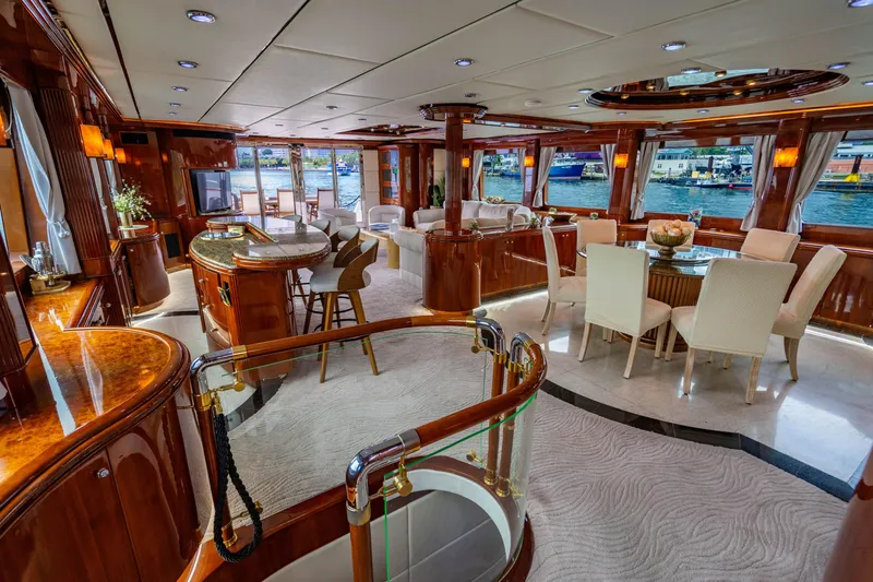 Slide: The Image of Luxurious interior of 2000 Destiny Flybridge Motor Yacht with elegant dining and seating areas. - 5