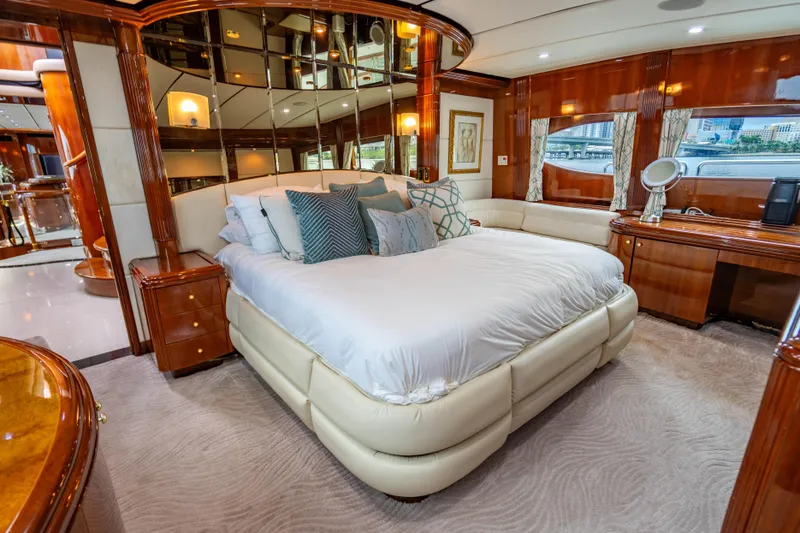 Slide: The Image of Luxurious bedroom interior of 2000 Destiny Flybridge Motor Yacht with elegant wood finishes. - 9