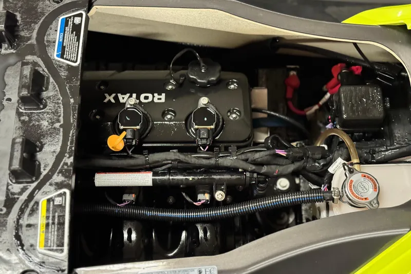 Slide: The Image of Engine compartment of a 2021 Sea-Doo GTR 230 with Rotax engine components. - 11