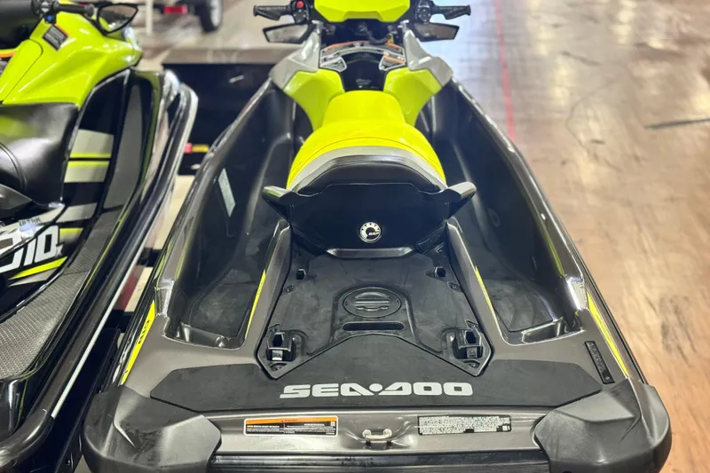 Slide: The Image of 2021 Sea-Doo GTR 230 jet ski, vibrant yellow and black design, rear view. - 4