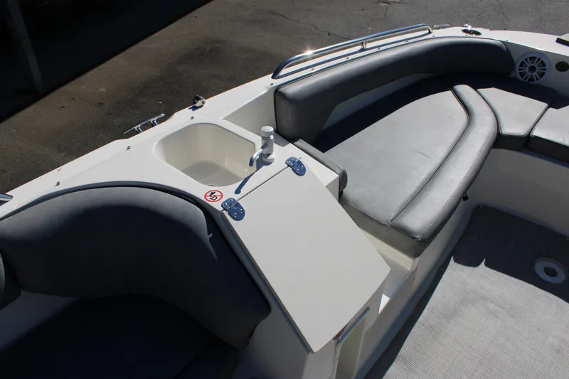 Slide: The Image of 2020 Stingray 192SC boat interior with seating and sink area. - 12