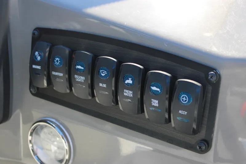 Slide: The Image of Control panel of 2020 Stingray 192SC boat with labeled switches. - 13