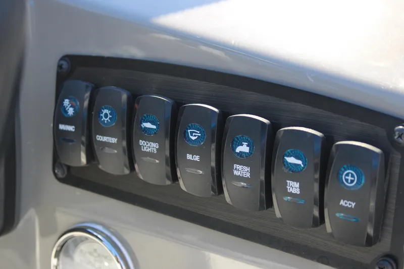 Slide: The Image of Control panel of a 2020 Stingray 192SC boat with labeled switches. - 14