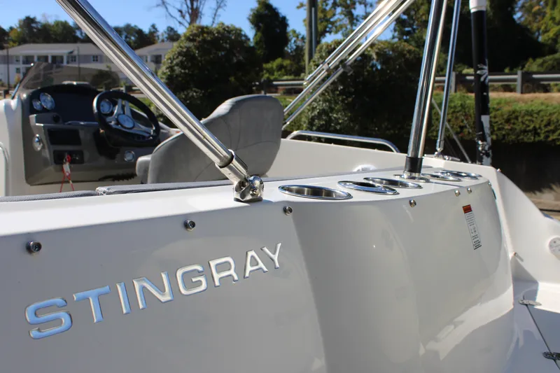 Slide: The Image of 2020 Stingray 192SC boat interior with steering wheel and cup holders. - 20