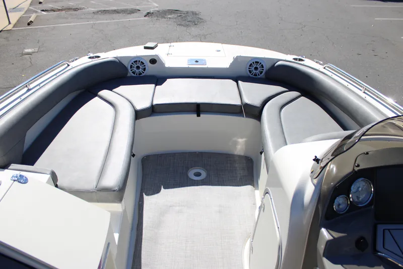 Slide: The Image of 2020 Stingray 192SC boat interior with gray seating and dashboard. - 3