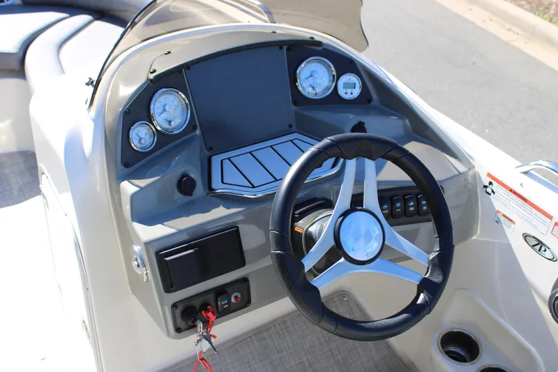 Slide: The Image of 2020 Stingray 192SC boat dashboard with steering wheel and gauges. - 6