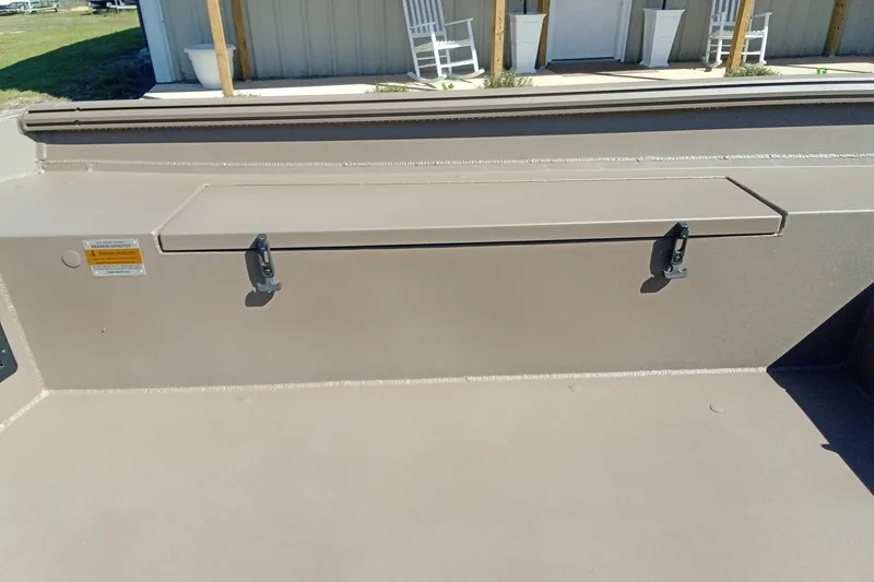 Slide: The Image of Thor 1754 Fish Hammer 2026 boat storage compartment with latches, outdoor setting. - 11