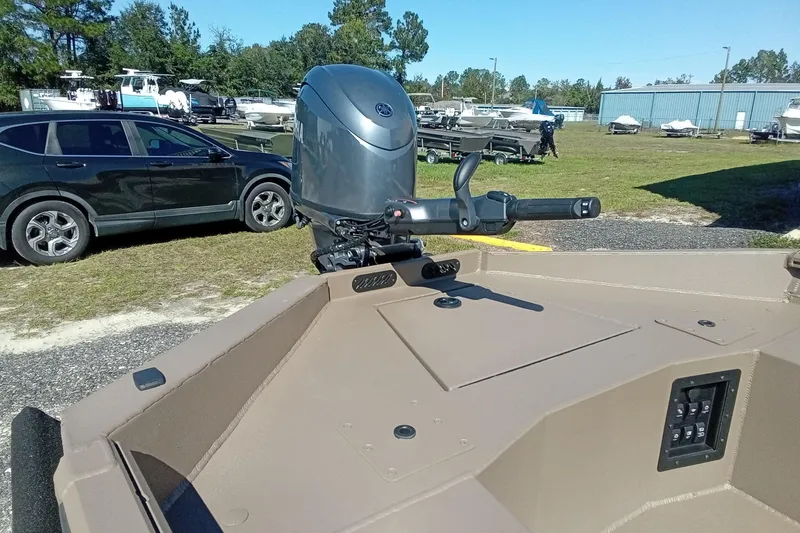 Slide: The Image of 2026 Thor 1754 Fish Hammer boat with outboard motor in a boatyard. - 13