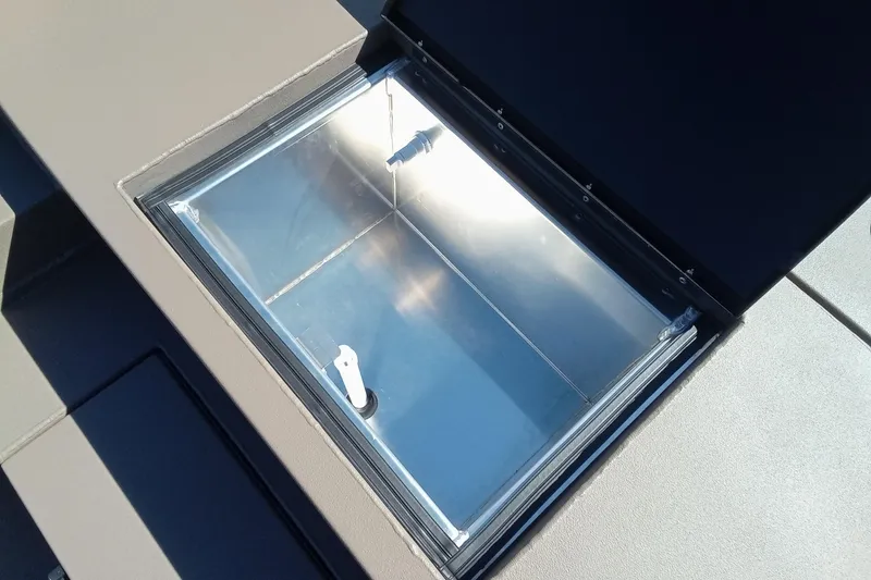 Slide: The Image of Open storage compartment on 2026 Thor 1754 Fish Hammer boat. - 9