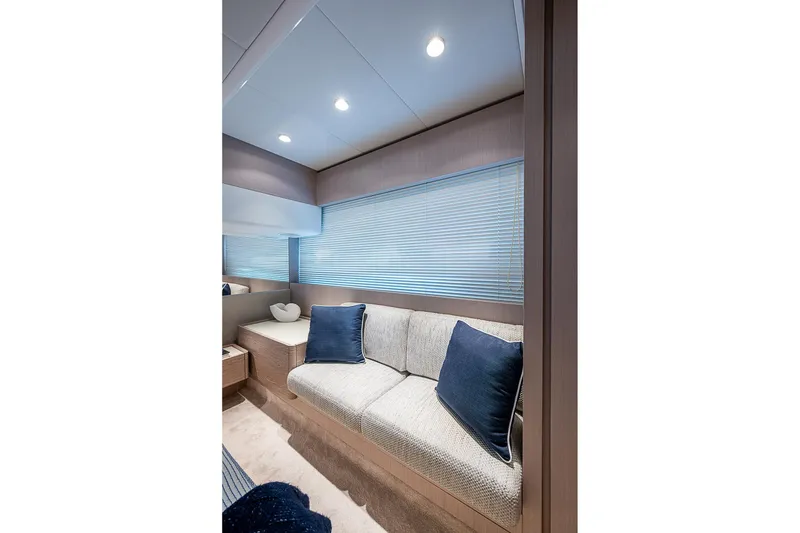 Slide: The Image of Luxurious interior of 2021 Ferretti Yachts 500 with cozy seating and elegant decor. - 28