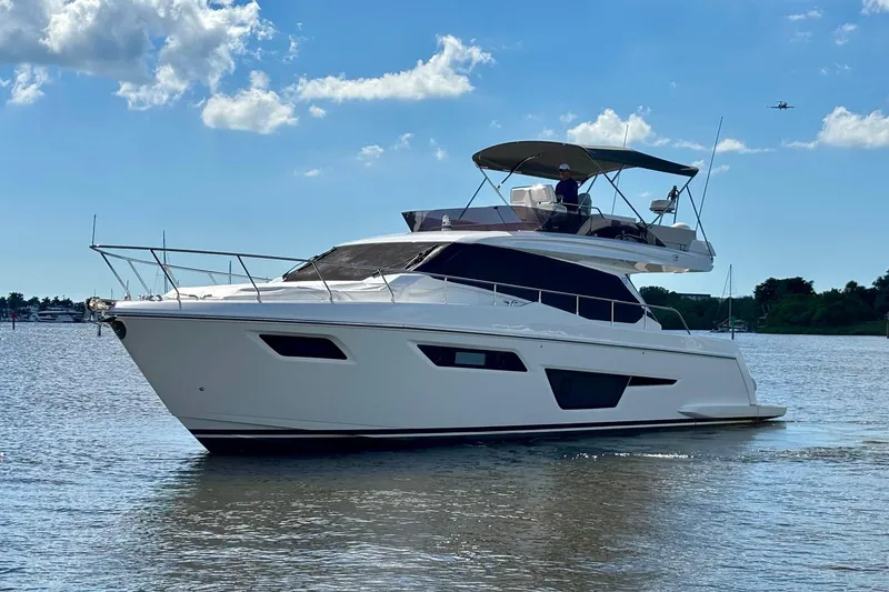 Slide: The Image of 2021 Ferretti Yachts 500 cruising on a sunny day, showcasing sleek design and luxury. - 5